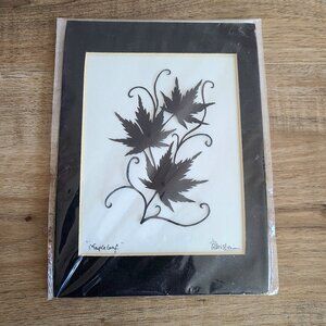 ''Maple Leaf'' art work paper cuttings silhouette by Steven Gu, Canadian artist.